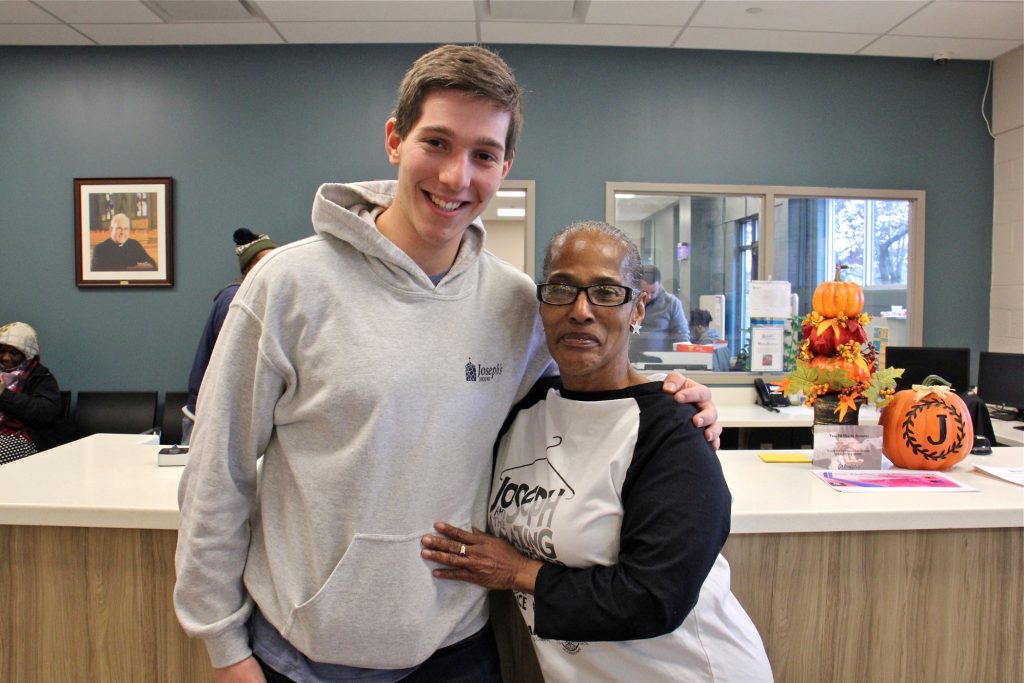 2019 11 12-e lee nitan shanas liz holmes-camden josephs house-rutgers homeless fundraiser Rutgers-Camden student Nitan Shanas embraces Joseph's House client and volunteer Liz Holmes in the lobby of the Camden homeless shelter where they met. (Emma Lee/WHYY)