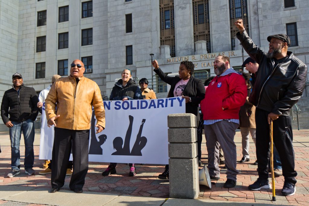 2019 11 19 k paynter anti housing takeover rally-2 Camden residents opposed to a county take-over of housing inspection and code enforcement rallied in front of Camden City Hall Tuesday. (Kimberly Paynter/WHYY)