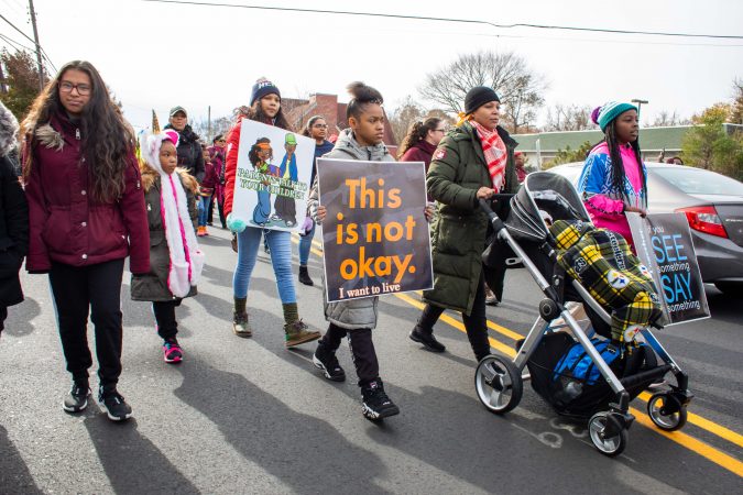Approximately 150 people attended the march in Pleasantville, including students and families. (Becca Haydu for WHYY)