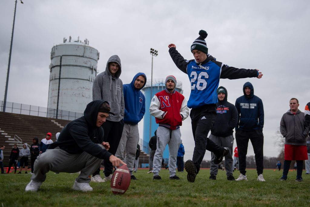 20191117_WHYY_Football With Disabilities_D750_021 Justin Gabor runs up for a kick during practice at Neshaminy High School. (Kriston Jae Bethel for WHYY)