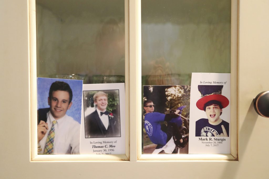 Jimi Patrick, Tom Meo, Dean Finocchiaro, Mark Sturgis In this Monday, July 2, 2018 photo, four photos, from left, of Jimi Patrick, Tom Meo, Dean Finocchiaro, and Mark Sturgis are placed in a kitchen cabinet window in the home of the grandparents of Patrick, nearing the anniversary of the murders of the four young men in Bucks County in July 2017. Cosmo DiNardo and his cousin Sean Kratz, both 21, were charged in the killings the next day, July 14. (David Swanson/The Philadelphia Inquirer via AP)