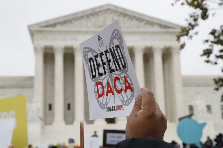 People rally outside the Supreme Court as oral arguments are heard in the case of President Trump's decision to end the Obama-era, Deferred Action for Childhood Arrivals program (DACA), Tuesday, Nov. 12, 2019, at the Supreme Court in Washington. (AP Photo/Jacquelyn Martin)