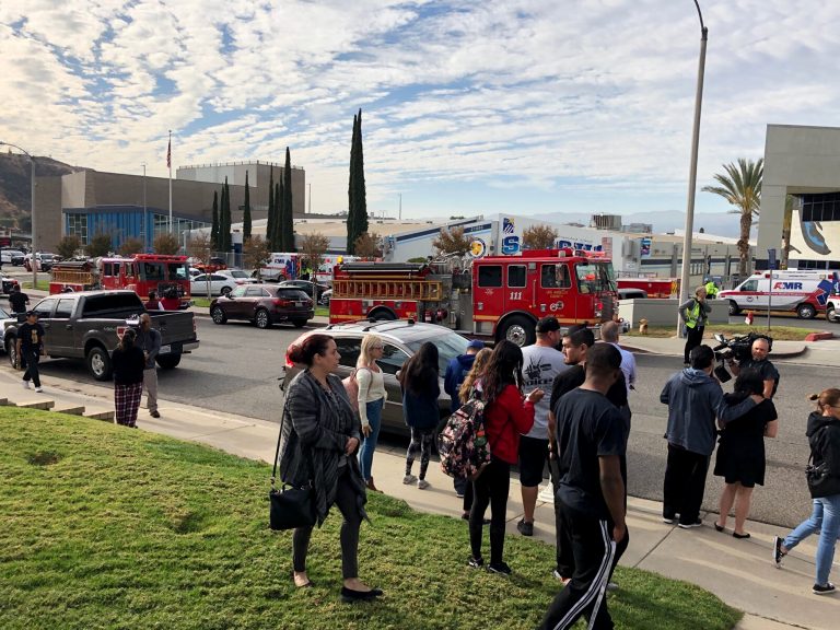 People wait for students and updates outside of Saugus High School after reports of a shooting on Thursday, Nov. 14, 2019, in Santa Clarita, Calif. (Marcio Jose Sanchez/AP Photo)