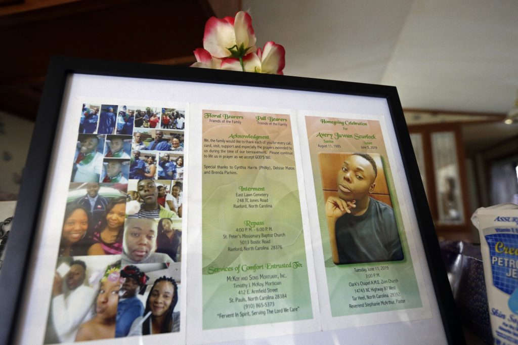 Transgender Rights In this photo taken Tuesday, Aug. 6, 2019, a framed copy of Avery Scurlock's memorial is shown in Avery's mother Brenda Scurlock's home in Lumber Bridge, N.C. Avery, who used the name Chanel when dressing as a woman in social settings and hoped to have sex reassignment surgery, was found shot to death in June. This death of a transgender person in North Carolina is one of 18 so far this year, and 17 of the victims have been black women. (Gerry Broome/AP Photo)