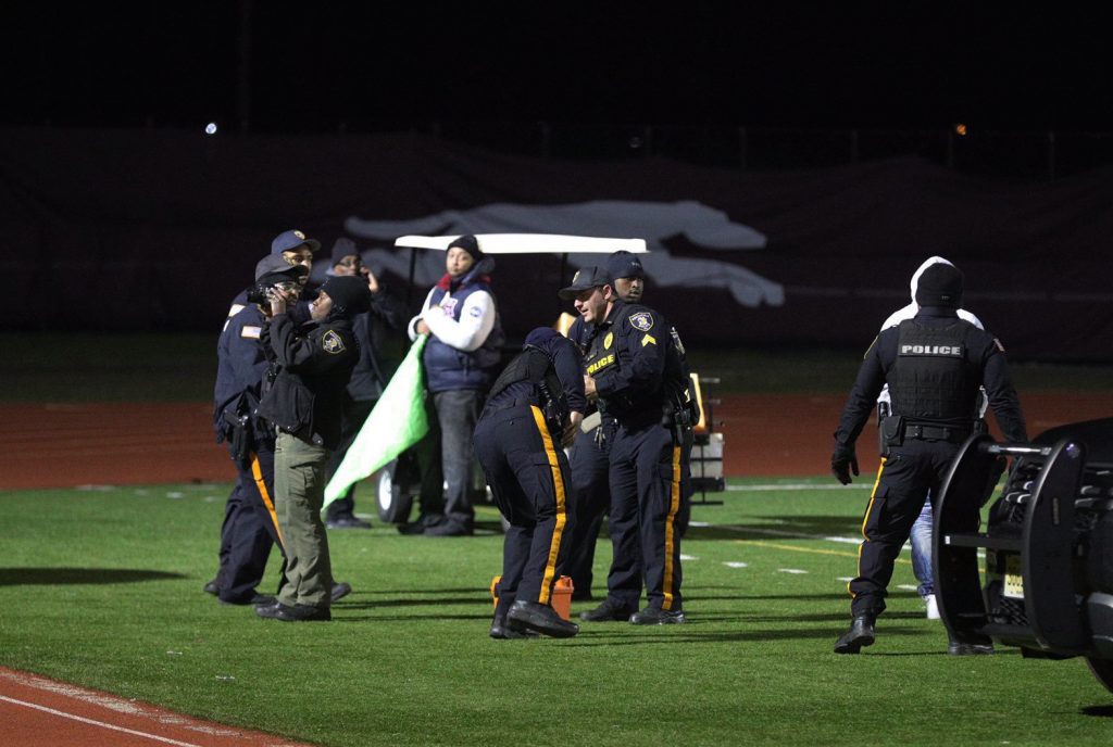 APTOPIX High School Game Shooting police on the football field