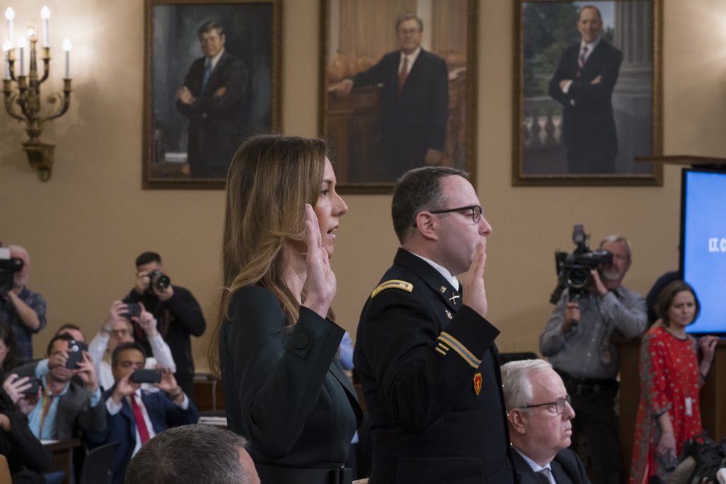 Jennifer Williams,Alexander Vindman Jennifer Williams, (left), an aide to Vice President Mike Pence, and National Security Council aide Lt. Col. Alexander Vindman, are sworn in to testify before the House Intelligence Committee on Capitol Hill in Washington, Tuesday, Nov. 19, 2019, during a public impeachment hearing of President Donald Trump's efforts to tie U.S. aid for Ukraine to investigations of his political opponents. (J. Scott Applewhite/AP Photo)