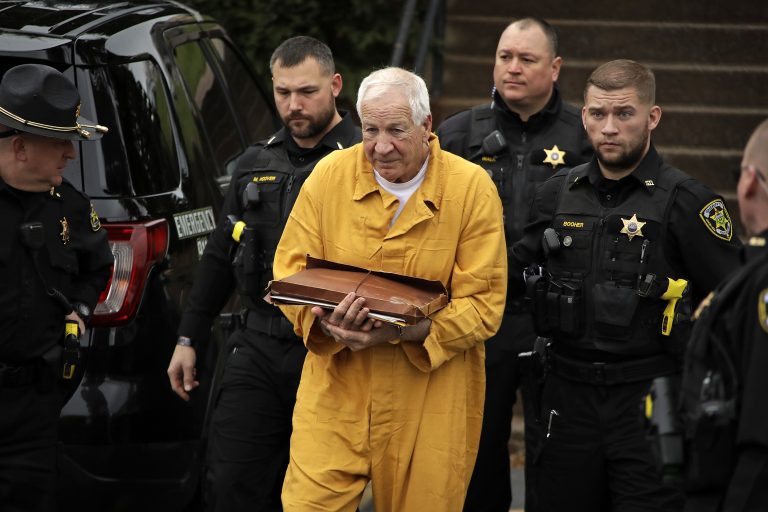 AP_19326640975938-768×512 Former Penn State University assistant football coach Jerry Sandusky, center, arrives at the Centre County Courthouse for resentencing on his 45-count child sexual abuse conviction Friday, Nov. 22, 2019. (Gene J. Puskar/AP Photo)