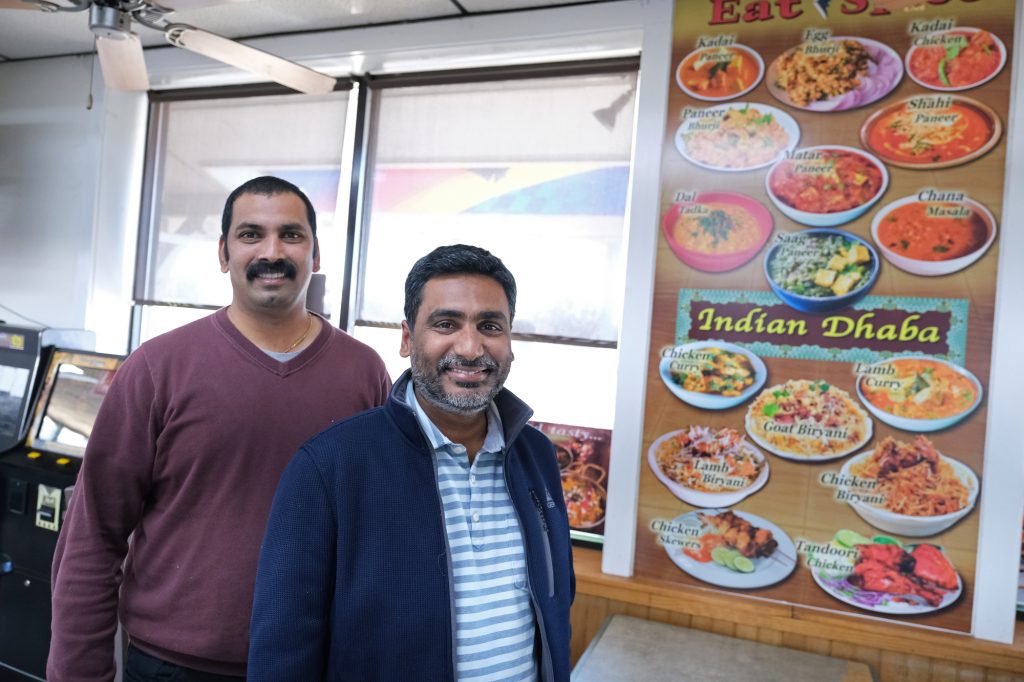 Eat Spice Truck Stop Profile 03 Eat Spice co-owners Vamsi Yaramaka, left, and Raj Alturu stand inside at their truck stop on route 534 off I-80 in White Haven, Pennsylvania. The restaurant offers dishes that are hard to find amid typical American fast food fare. (Matt Smith for Keystone Crossroads)