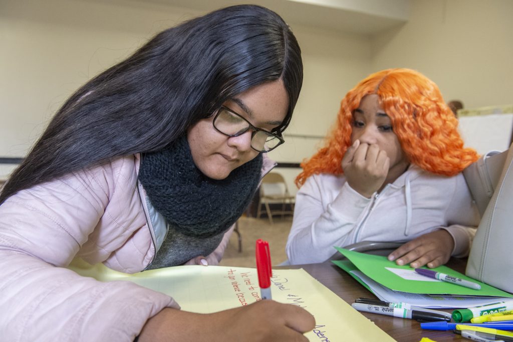GUN VIOLENCE Parkway Northwest High School students Kaila Daniel, left and Makayla Adens, right, during a break out session at a community summit on gun violence. (Jonathan Wilson for WHYY)