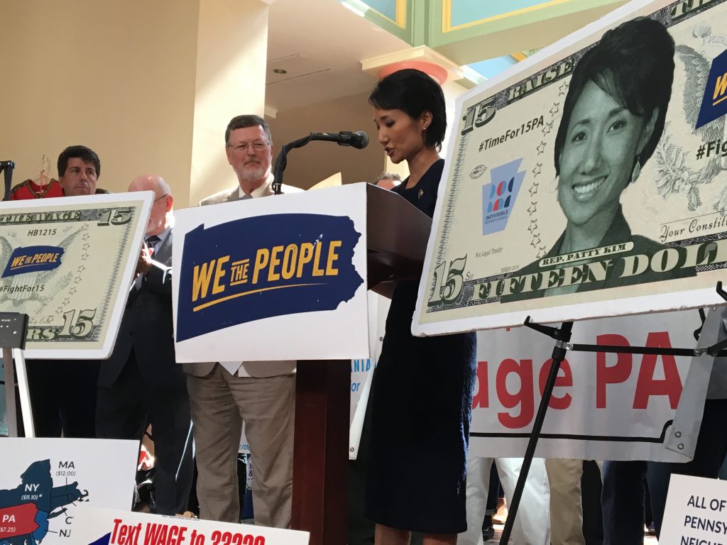 IMG_2763 Representative Patty Kim speaks at a September 17 rally for a higher minimum wage. Advocates have been using the likenesses of Kim and her co-sponsor, Representative Chris Rabb, in their lobbying effort. (Katie Meyer / WITF)