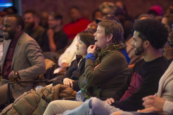 Audience members respond to comedian Chris Cotton. (Jonathan Wilson for WHYY)