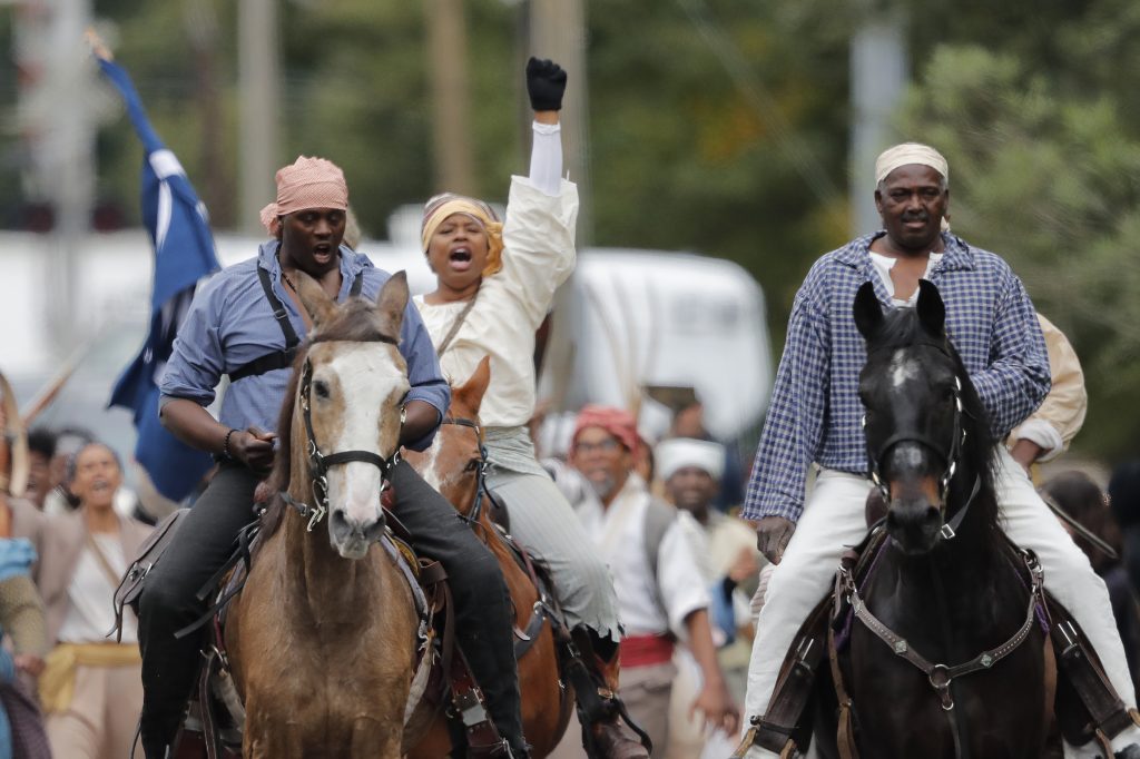 Volunteers participate in a reenactment of what is thought to be the largest slave rebellion in U.S. history in LaPlace, La., on Friday. (Gerald Herbert/AP Photo)