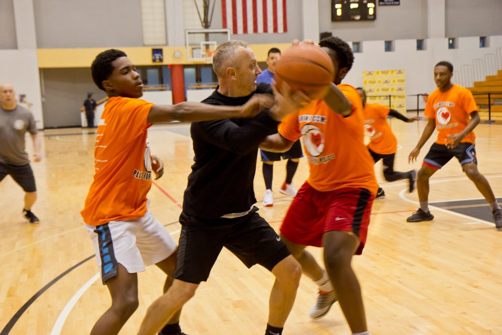 parkwaybasketball-kimpaynter7 9th district police officers face off against sophomores from Parkway Center City Middle College at a tournament to raise awareness of gun violence in Philadelphia. (Kimberly Paynter/WHYY)