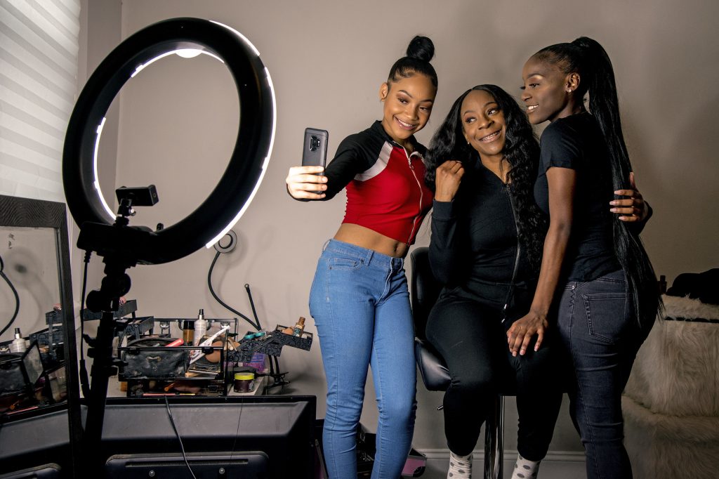 Years ago, Portia Smith (center) suffered postpartum depression and feared seeking care because of child welfare involvement. She and her daughters Shanell Smith (right), 19, and Najai Jones Smith (left), 15, pose for a selfie after makeup artist Najai madeup everyone as they were getting ready at home on Feb. 6, 2019, to go to a movie together. Years ago, Portia Smith (center) suffered postpartum depression and feared seeking care because of child welfare involvement. She and her daughters Shanell Smith (right), 19, and Najai Jones Smith (left), 15, pose for a selfie after makeup artist Najai madeup everyone as they were getting ready at home on Feb. 6, 2019, to go to a movie together. (Tom Gralish/Philadelphia Inquirer)