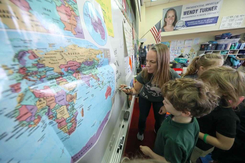 News 2019 – DEC 12 – Teacher global awareness Teacher Wendy Turner writes down notes on the whiteboard during a global awareness session at Mount Pleasant Elementary School in Wilmington. (Saquan Stimpson for WHYY)