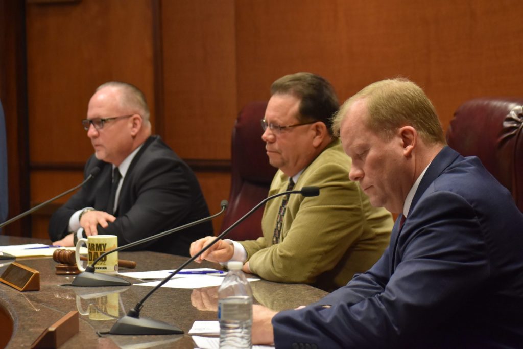 191230commishprofile-1920×1280 Dauphin County Commissioners George Hartwick, Jeff Haste and Mike Pries before voting 2-1 to negotiate a contract with Clear Ballot for new voting machines during a special session Monday in Harrisburg. Haste voted against it. (Emily Previti/PA Post)