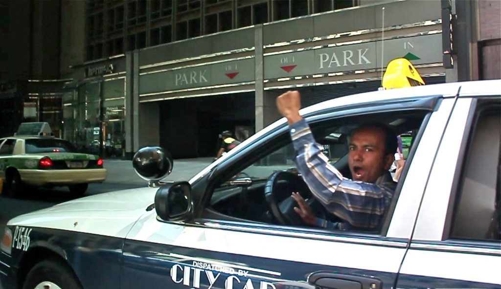 2012-provided-philadelphia market street-taxi fee hike protest Taxi drivers honk their horns and chant 'PPA Mafia' as they drive slowly down Market Street toward City Hall during a protest against fee hikes in 2012. A video of the protest is part of the People's Media Record, an online archive set up by the Media Mobilizing Project. (Still from video)