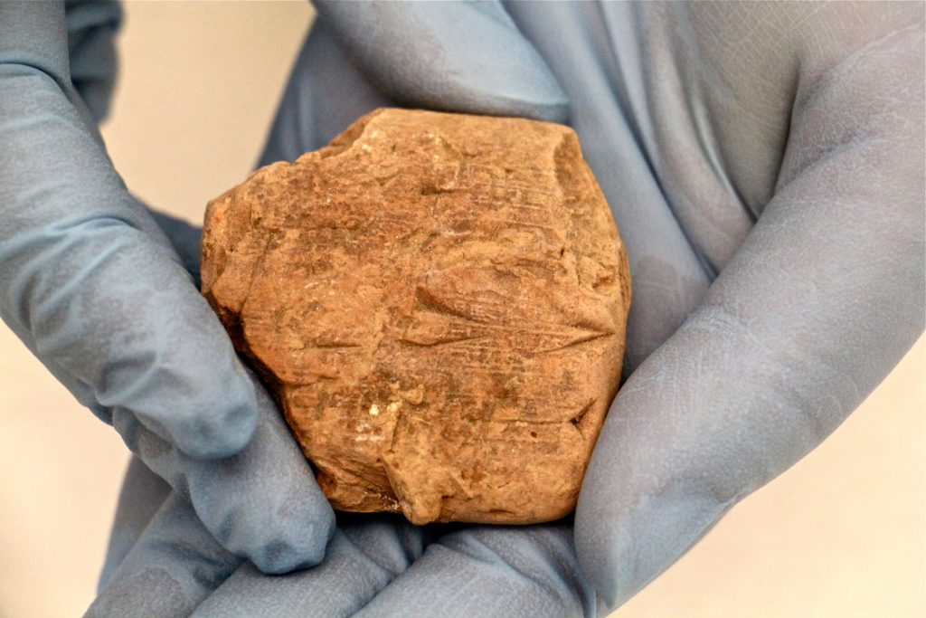 2019 12 03-e lee-philadelphia penn museum-clay tablet fragments from iraq A fragment of clay tablet at the Penn Museum carries information about a business transaction that took place in Ur about 4,000 years ago. (Emma Lee/WHYY)