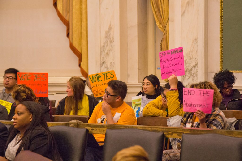 2019 12 03 k paynter tax abatement-3 Activists urge City Council members to vote to end the 10-year property tax abatement. (Kimberly Paynter/WHYY)