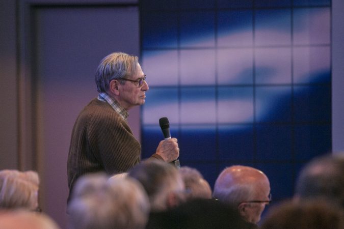 An audience member asks a question to Washington Week and national political reporter for The Washington Post, Robert Costa, during a political talk at WHYY on Saturday, December 7.