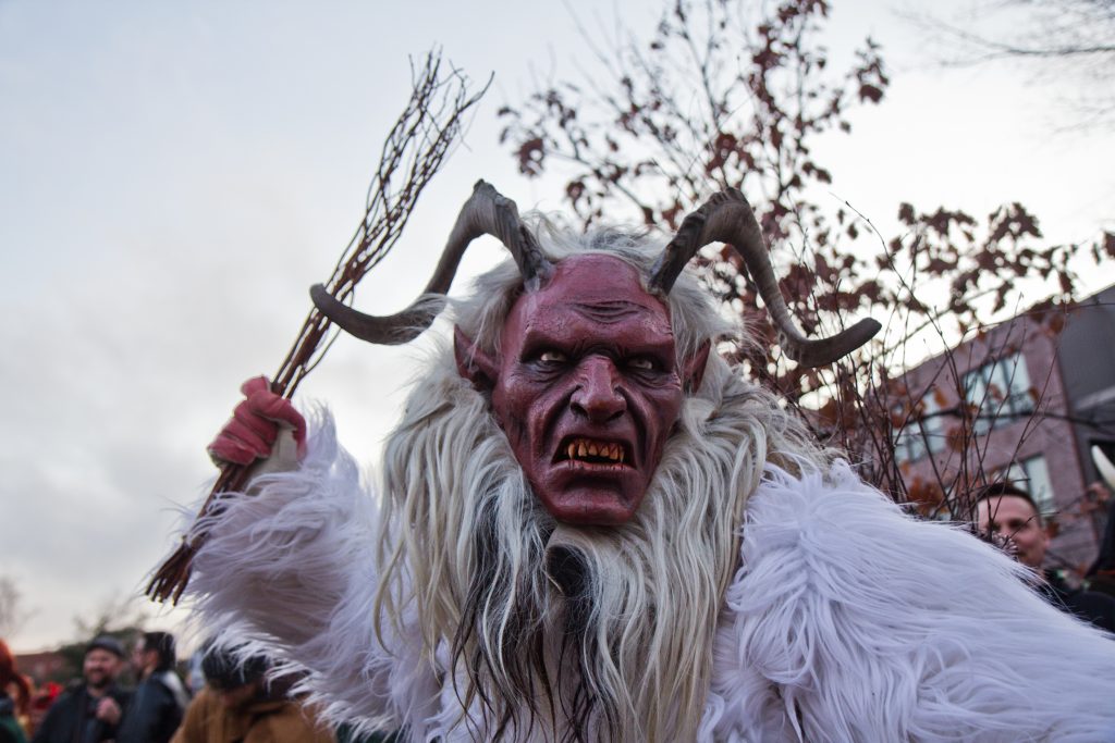 2019 12 14 k paynter parade of spirits-12 Graydon Dunkelberger studied abroad in Austria where he learned about Krampus. His was was hand carved in Austria. (Kimberly Paynter/WHYY)