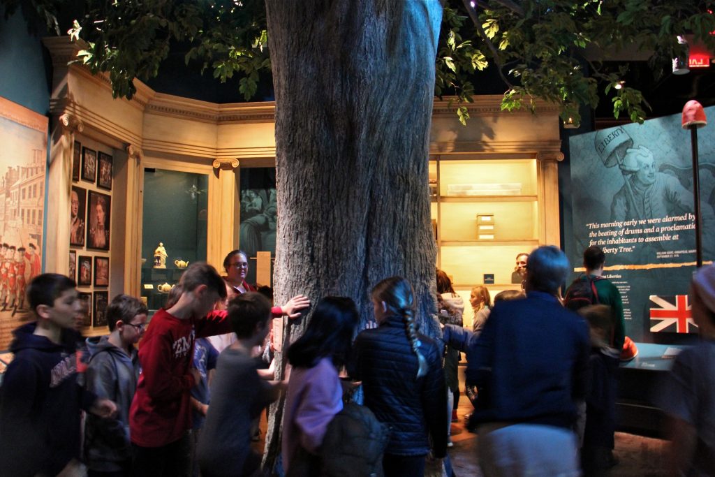 2019 12 18-e lee-museum of the american revolution-autistic accessible The exhibit room that houses the Liberty Tree at the Museum of the American Revolution is softly lit and full of tactile experiences, but the hubbub can be too much for some children with autism. (Emma Lee/WHYY)