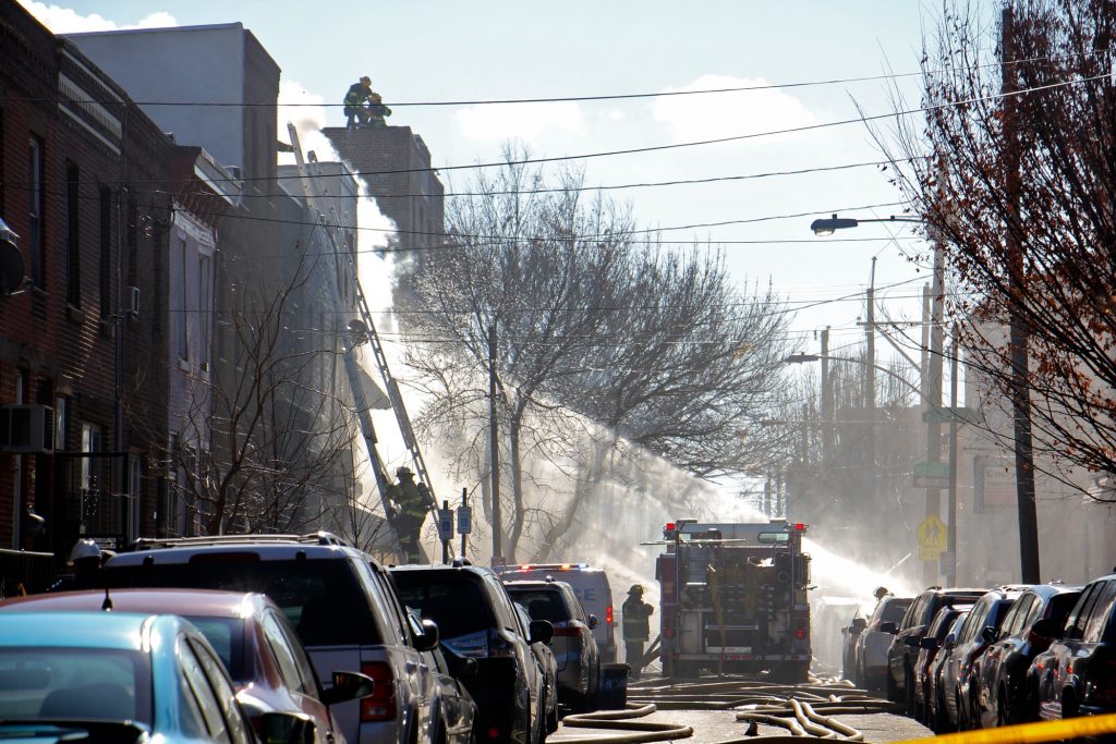 2019 12 19-e lee-philadelphia south 8th street-rowhouse fire Firefighters respond to a fire in the 1400 block of South 8th Street. (Emma Lee/WHYY)