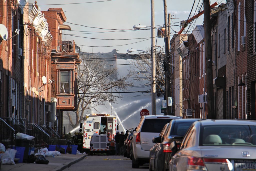 2019 12 19-e lee-philadelphia south 8th street-rowhouse fire Firefighters hose down the remains of two rowhouses