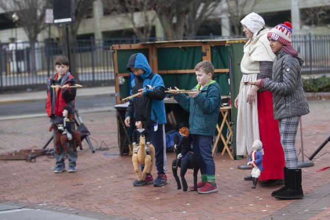 Kids participate in a puppet show. (Miguel Martinez for WHYY)