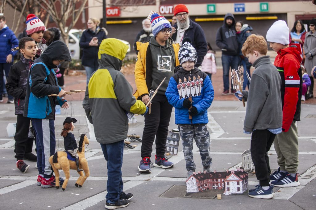 Hounds walk to help save others of their kind Kids participate in a puppet show at Warren Street Plaza to explain the historical role of Trenton in the Revolutionary War. (Miguel Martinez for WHYY)