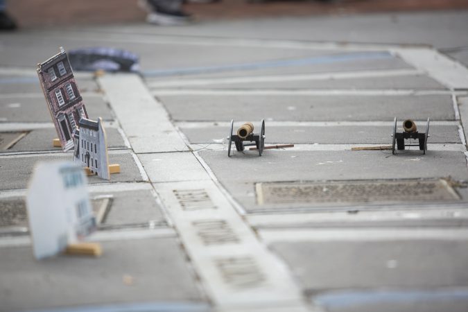 The miniatures include buildings and cannons. (Miguel Martinez for WHYY)