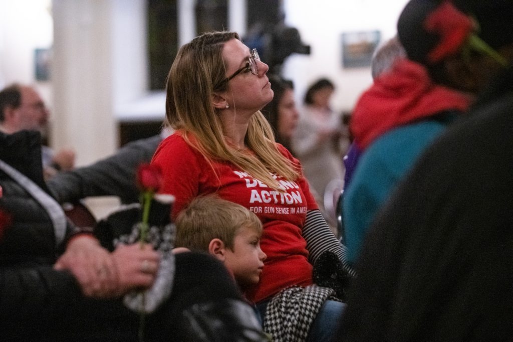 20191211_WHYY_Sandy Hook Vigil_013 Joyce Pickles of Moms Demand Action sits with her son Dominic, 6, during a vigil for gun violence victims at Broad Street Ministry on Wednesday, December 11, 2019. (Kriston Jae Bethel for WHYY)