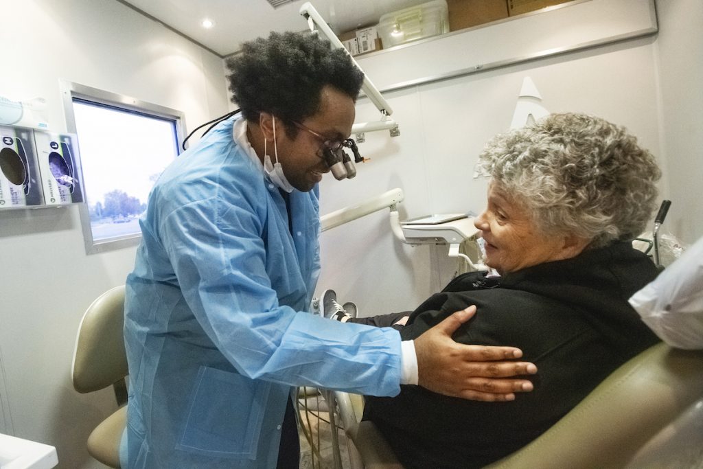 Aspen Dental MouthMobile in Kennewick, Washington Aspen Dental dentist Dr. David Roberts, left talks to a patient inside the MouthMobile which travels the country giving free dental care to veterans, in Kennewick, Wash. on Monday, Oct. 21, 2019.
