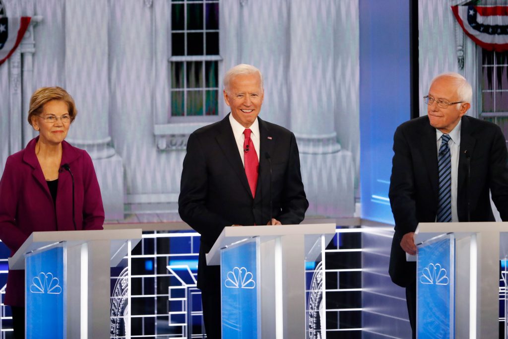 AP_19325082096507 From left, Democratic presidential candidates Sen. Elizabeth Warren, D-Mass., former Vice President Joe Biden and Sen. Bernie Sanders, I-Vt., participate in a Democratic presidential primary debate, Wednesday, Nov. 20, 2019, in Atlanta. (AP Photo/John Bazemore)