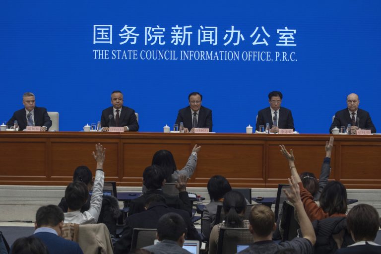 Shohrat Zakir, chairman of China's Xinjiang Uighur Autonomous Region, (center), waits for questions during a press conference in Beijing on Monday, Dec. 9, 2019. (Ng Han Guan/AP Photo)