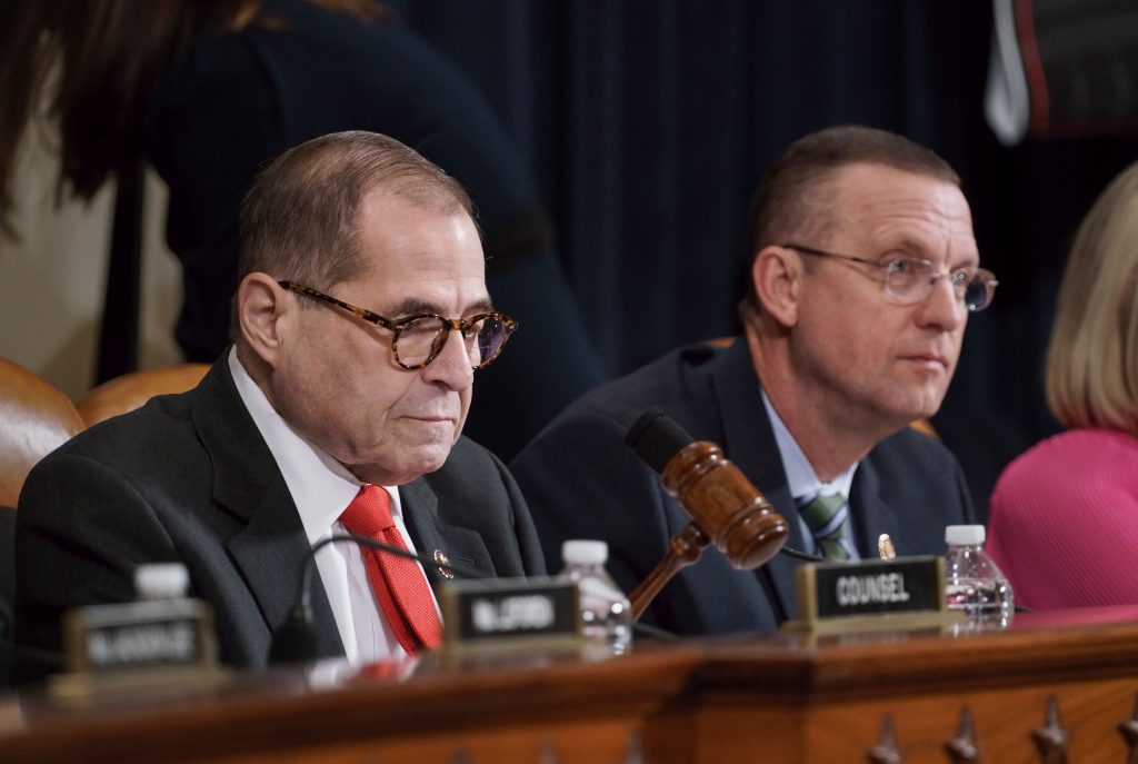 AP_19343547791914 House Judiciary Committee Chairman Jerrold Nadler, D-N.Y., left, joined by Rep. Doug Collins, R-Ga., the ranking member, using his gavel to call for order as he convenes a hearing to hear investigative findings in the impeachment inquiry against President Donald Trump, on Capitol Hill in Washington, Monday, Dec. 9, 2019. (AP Photo/J. Scott Applewhite)