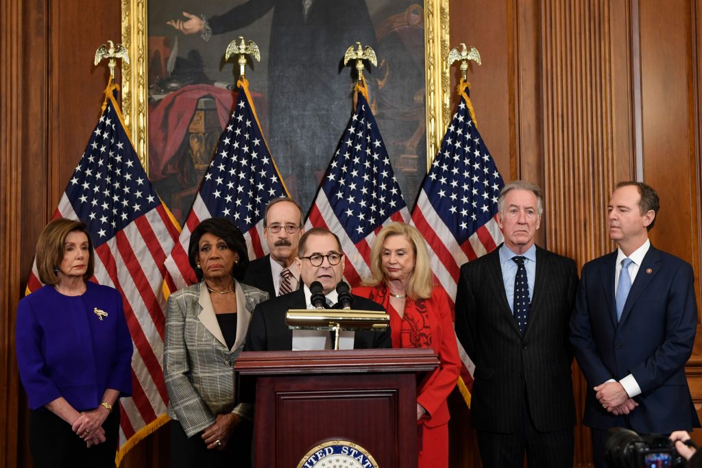 AP_19344514547992 From left House Speaker Nancy Pelosi, Chairwoman of the House Financial Services Committee Maxine Waters, D-Calif., Chairman of the House Foreign Affairs Committee Eliot Engel, D-N.Y., House Judiciary Committee Chairman Jerrold Nadler, D-N.Y., Chairwoman of the House Committee on Oversight and Reform Carolyn Maloney, D-N.Y., House Ways and Means Chairman Richard Neal and Chairman of the House Permanent Select Committee on Intelligence Adam Schiff, D-Calif., unveil articles of impeachment against President Donald Trump, during a news conference on Capitol Hill in Washington, Tuesday, Dec. 10, 2019.(AP Photo/Susan Walsh)