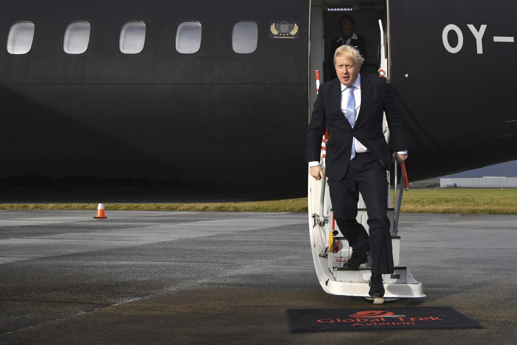 Britain Brexit Election Britain's Prime Minister Boris Johnson arrives at Cardiff Airport while on the General Election campaign trail in Wales, Wednesday, Dec. 11, 2019. Britain goes to the polls on Dec. 12. (Ben Stansall/Pool Photo via AP)