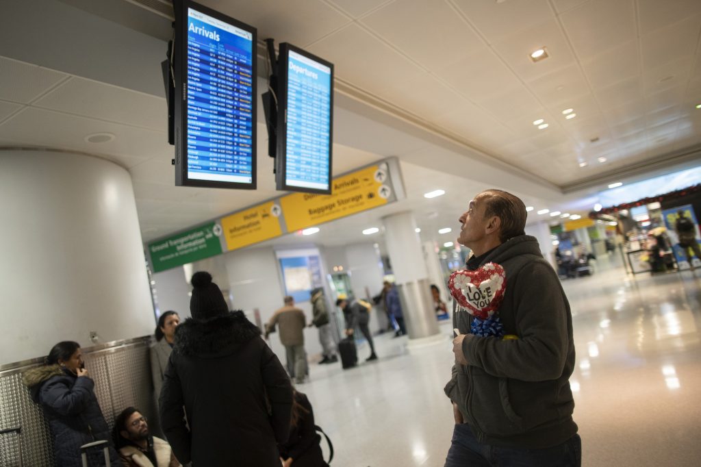 Travel Ban Waiver In this Dec. 3, 2019, photo, Mohammed Hafar checks the arrivals road while waiting for his daughter Jana Hafar's flight at JFK Airport in New York. Mohammed Hafar was part of a federal lawsuit filed in August of this year over the travel ban waiver process. “Every time I speak to her, she ask, ‘When are they going to give me the visa?'