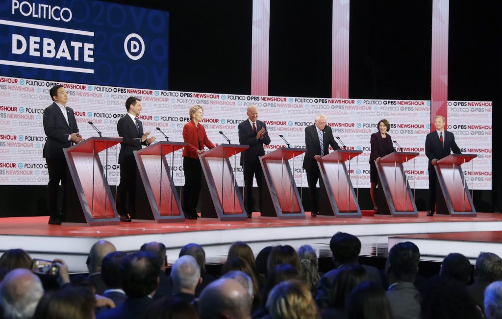 Election 2020 Debate Democratic presidential candidates from left, entrepreneur Andrew Yang, South Bend Mayor Pete Buttigieg, Sen. Elizabeth Warren, D-Mass., former Vice President Joe Biden, Sen. Bernie Sanders, I-Vt., Sen. Amy Klobuchar, D-Minn., and businessman Tom Steyer participate in a Democratic presidential primary debate Thursday, Dec. 19, 2019, in Los Angeles. (Chris Carlson/AP Photo)