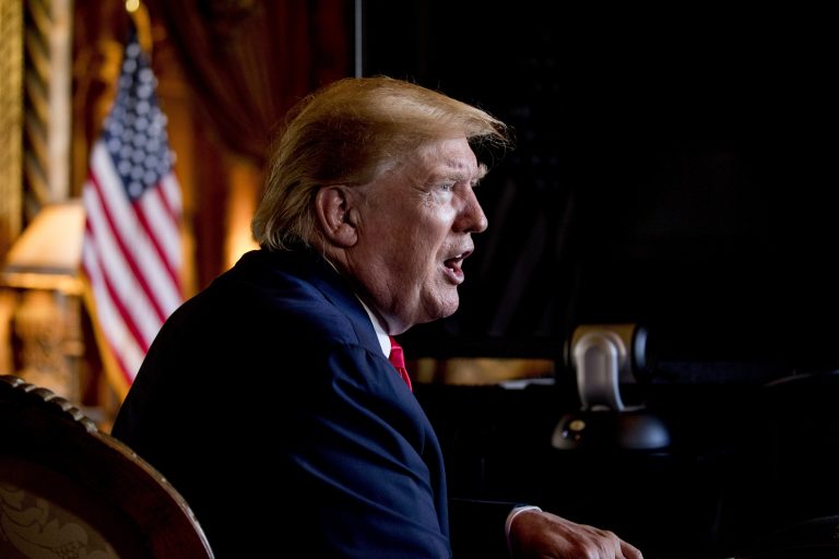 FILE - In this Dec. 24, 2019 photo, President Donald Trump speaks to members of the media following a Christmas Eve video teleconference with members of the military at his Mar-a-Lago estate in Palm Beach, Fla. (AP Photo/Andrew Harnik)