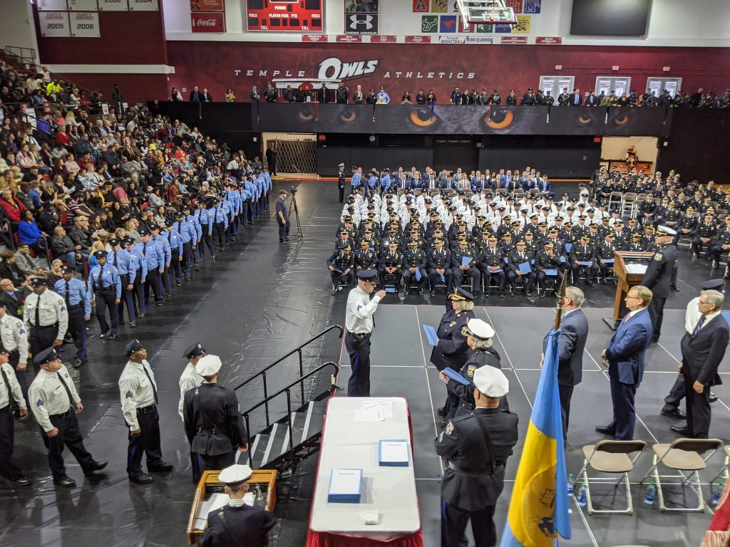 EK9CNcEXkAEZxpd The Philadelphia Police Department tweeted this photo on Wednesday of a ceremony at Temple University where nearly 200 officers were promoted, three of whom have been accused of misconduct. (Courtesy of Philadelphia Police)