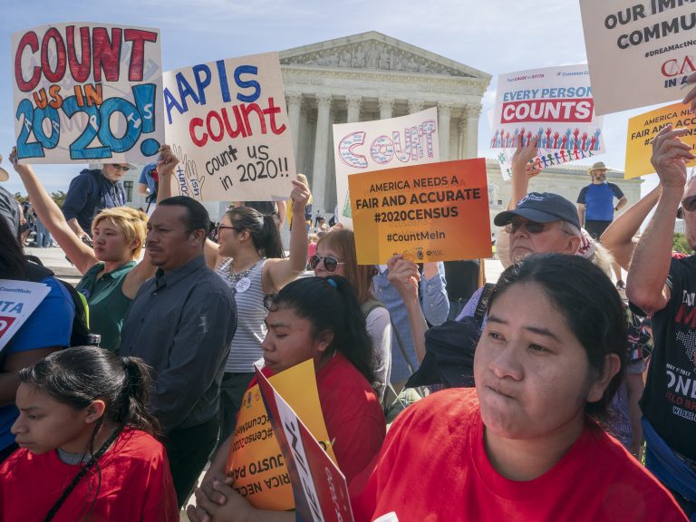 Demonstrators against the Trump administration's push to add a citizenship question to the 2020 census rally outside the U.S. Supreme Court in Washington, D.C., in April. (J. Scott Applewhite/AP)