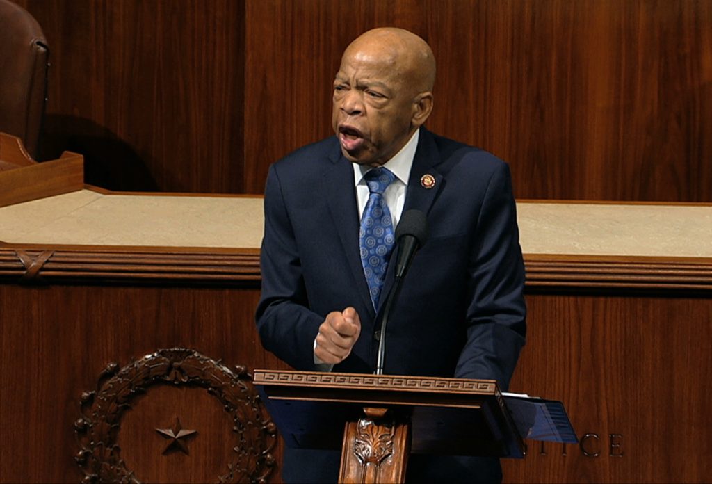 Rep. John Lewis, D-Ga., speaks as the House of Representatives debates the articles of impeachment against President Trump this month. Lewis says he’ll stay in office while he undergoes treatment for pancreatic cancer. Rep. John Lewis, D-Ga., speaks as the House of Representatives debates the articles of impeachment against President Trump this month. Lewis says he'll stay in office while he undergoes treatment for pancreatic cancer.
(House Television via AP)
