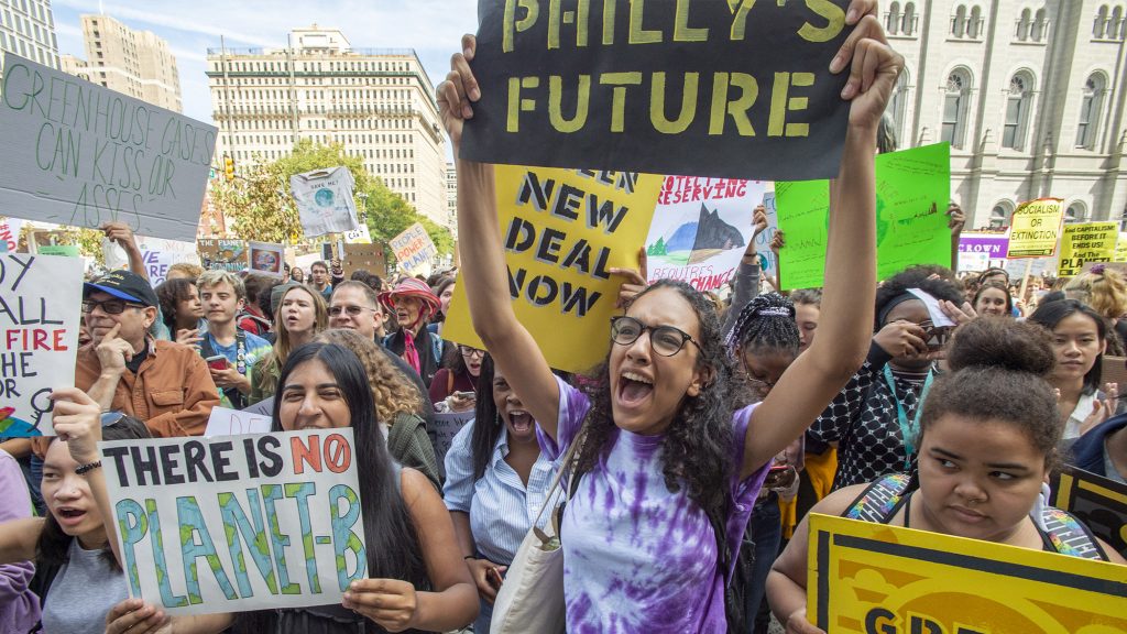climatestrike-studentprotest-crop Materman High School seniors Iman Acharya and Alina Kilcullen cheer speakers at a climate strike in September (Jonathan Wilson for WHYY)