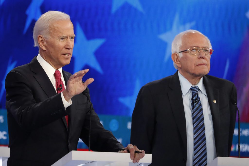 Election 2020 Debate Democratic presidential candidate former Vice President Joe Biden, left, speaks as Democratic presidential candidate Sen. Bernie Sanders, I-Vt., listens during a Democratic presidential primary debate, Wednesday, Nov. 20, 2019, in Atlanta. (AP Photo/John Bazemore)