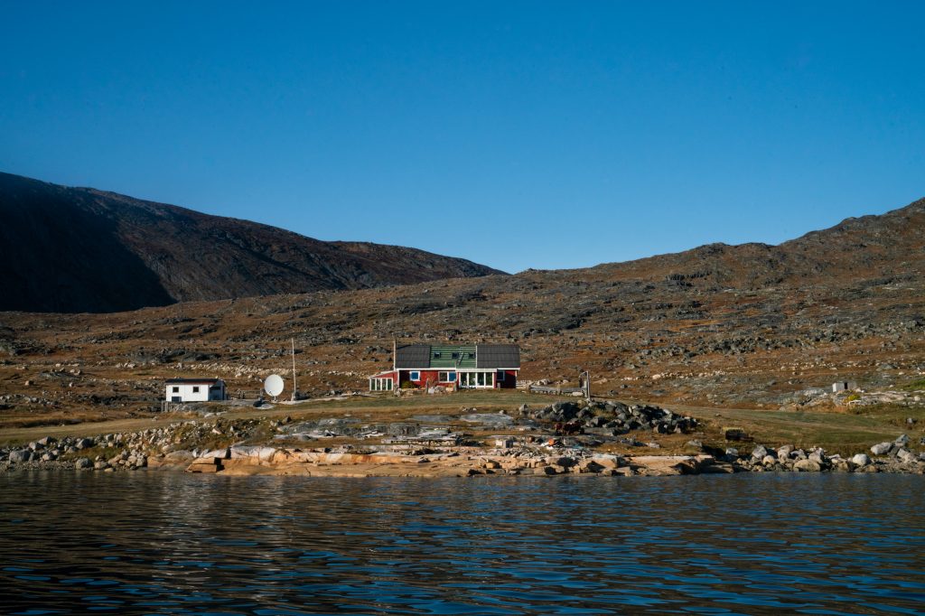 The Nielsens' sheep farm sits on the edge of a fjord in southern Greenland. The family has owned and run the farm since 1972. (Claire Harbage/NPR)