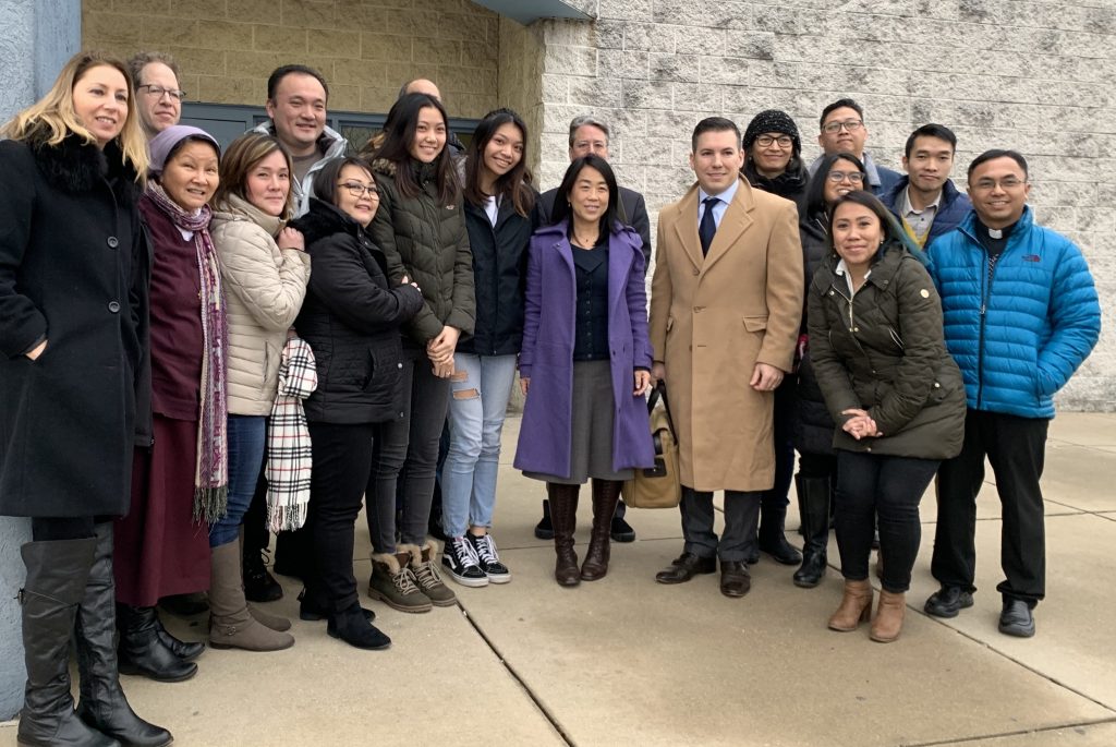  City Councilmember Helen Gym (middle) stands next to the Sukwanputra daughters and their family attorney Chris Casazza. They are surrounded by friends and family who traveled to York, Pa., to show their support at the hearing. (Dale Mezzacappa/The Notebook) 