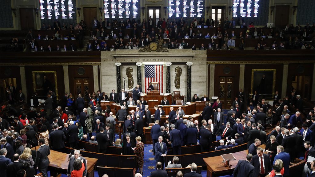 Nancy Pelosi House members vote as House Speaker Nancy Pelosi of Calif., stands on the dais, during a vote on article II of impeachment against President Donald Trump, Wednesday, Dec. 18, 2019, on Capitol Hill in Washington. (Patrick Semansky/AP Photo)