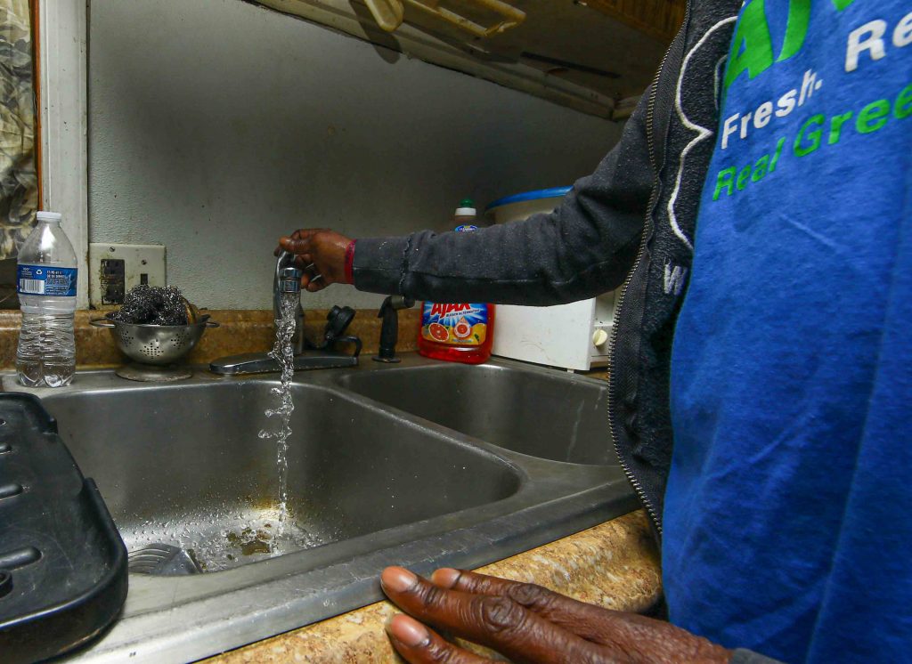 News 2019 – Oct 08 – Lincoln Delaware community without clean drinking water for decades Angialeen Mullen runs tap water to demonstrate the horrible smell coming from the faucet Tuesday, Oct. 08, 2019, in Ellendale, Del. (Saquan Stimpson for WHYY)